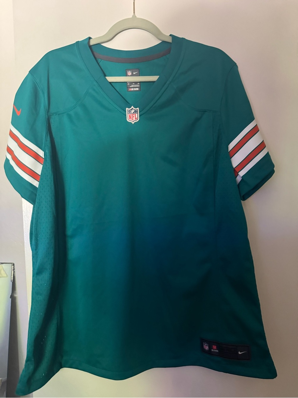 Nike Teal Kids Football Jersey with White & Orange Sleeve Stripes
